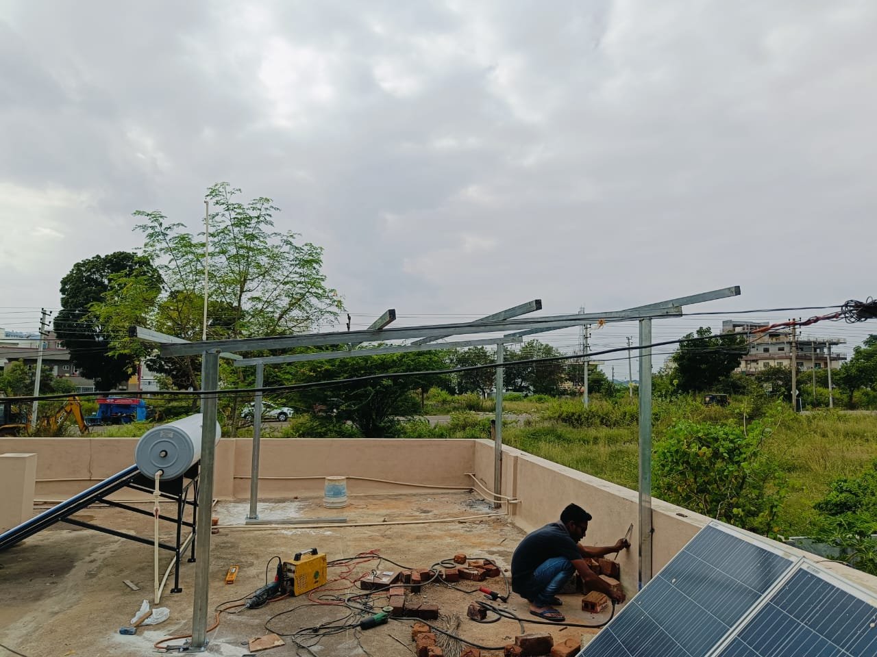 Technicians installing solar panels on a rooftop